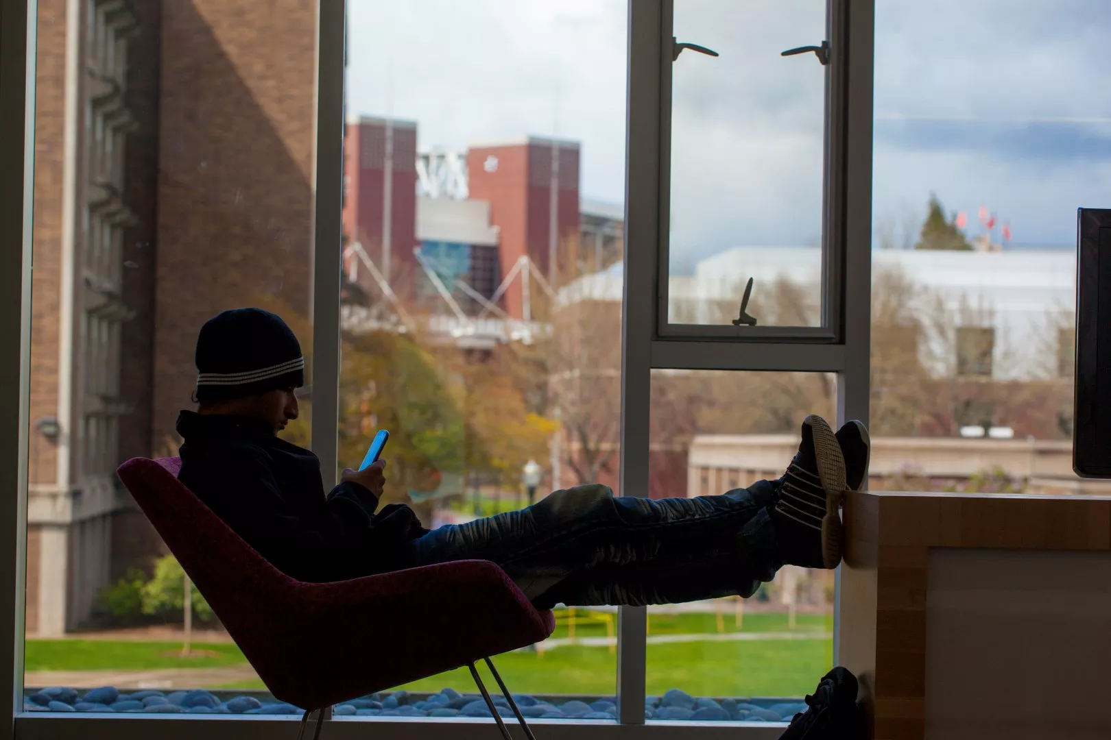 photo of student sitting by window