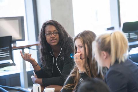 Students talking at a table