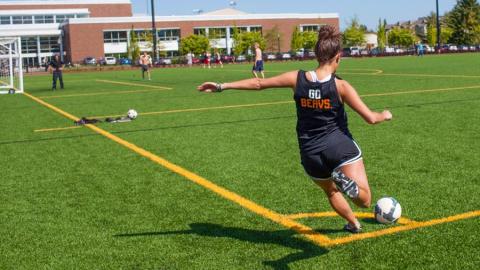 student playing soccer